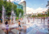 Things to Do in Houston When It’s Way Too Hot Kids playing on a splash pad with jets of water