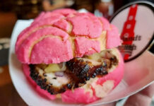 Top 12 Food & Drink Events in Houston This Month: July 2024 A close up of a barbecue sandwich in a pink concha bread