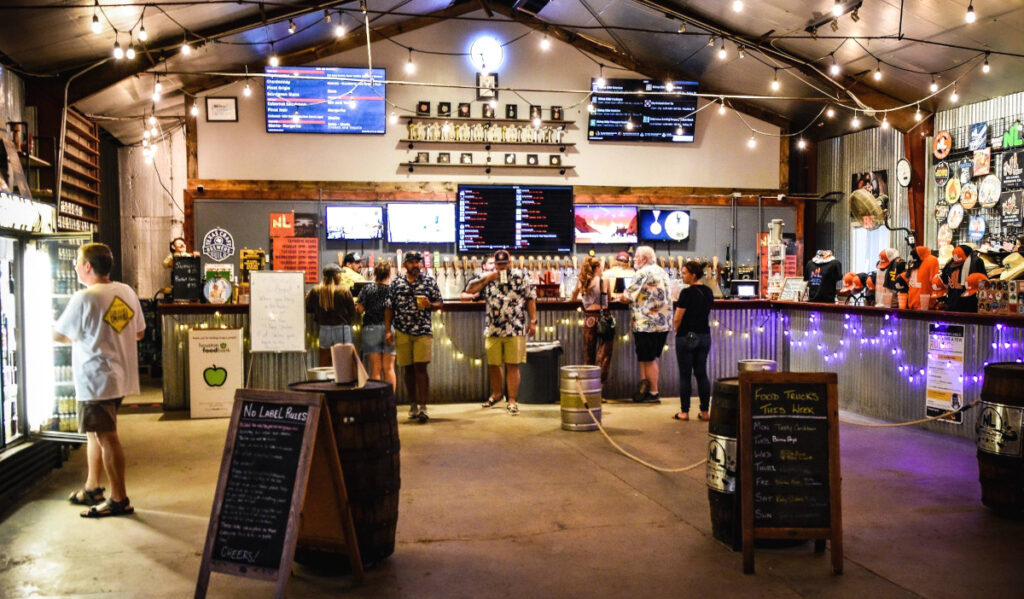 A brewery taproom with people ordering drinks