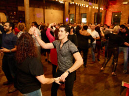 Pairs of people dancing on a dancefloor