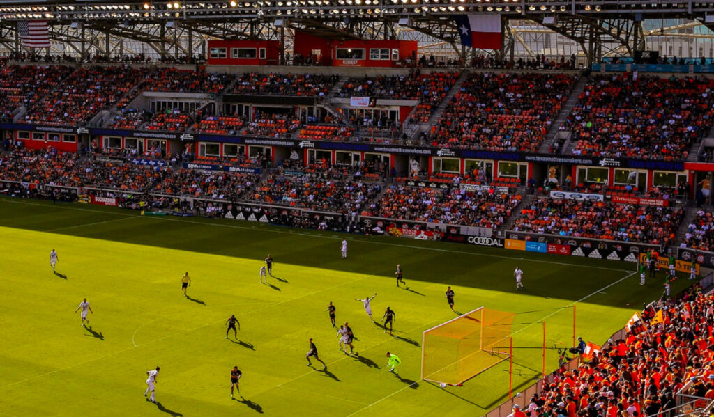 A view of the Dynamo playing soccer and rows of fans