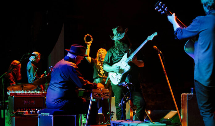 Chris Stapleton and his band performing on stage